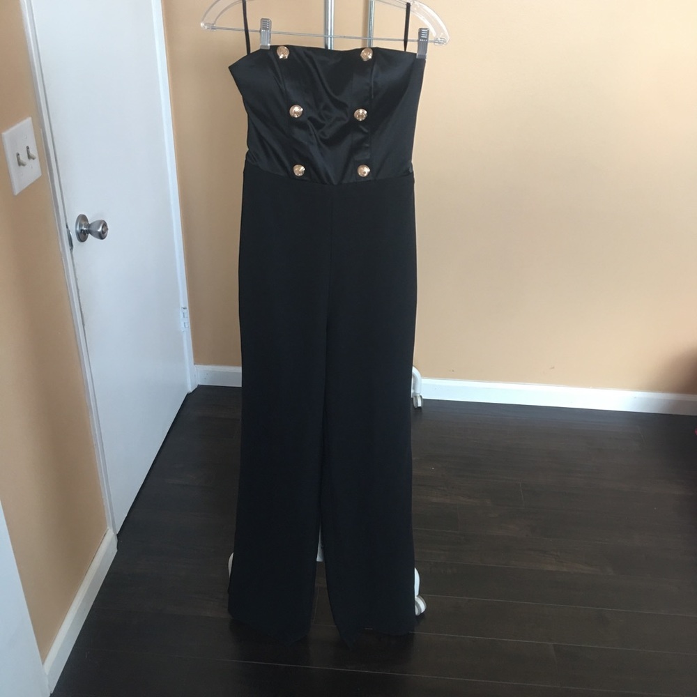 Black jumpsuits.